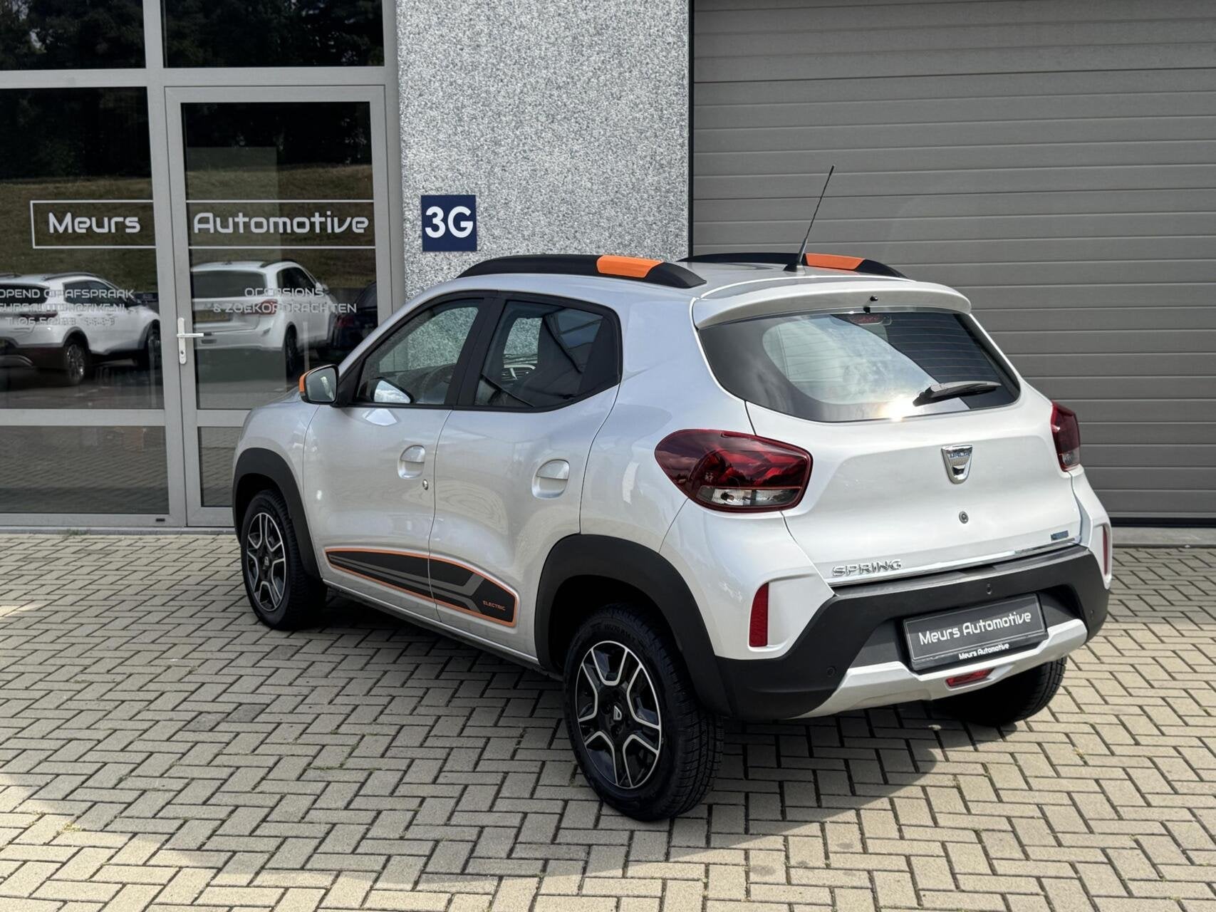 Dacia Spring Comfort Plus (Orange Pack) SOH 93% 27 kWh/Navi/, Gebruikt, Zwart, 230 km, Parkeersensor