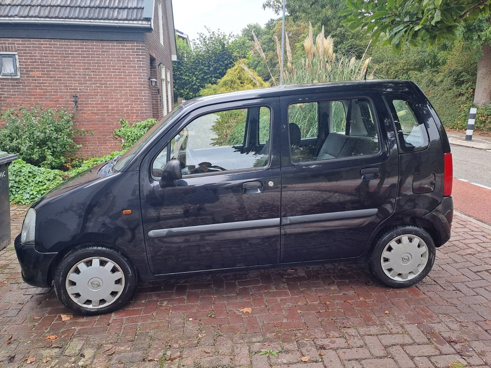 Opel Agila 1.2 I 16V 2004 Zwart, Auto's, Voorwielaandrijving, Zwart, Origineel Nederlands, Handgeschakeld