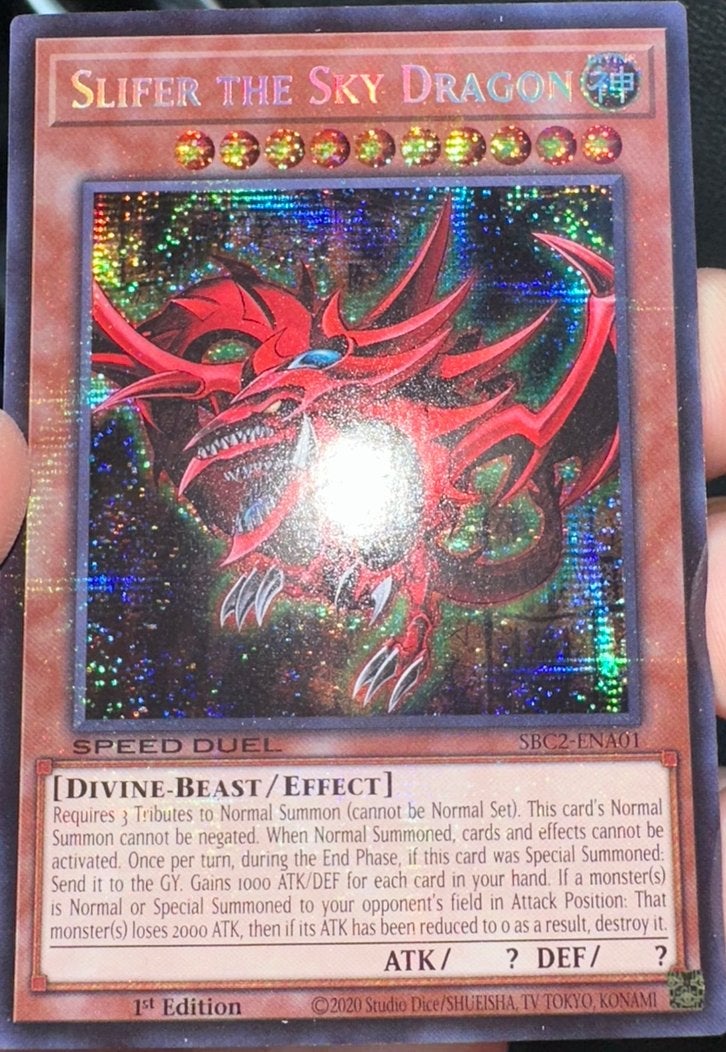 Yu-Gi-Oh! Slifer the Sky Dragon SBC2 1st Edition Duel Promo, Ophalen of Verzenden, Zo goed als nieuw, Losse kaart, Foil