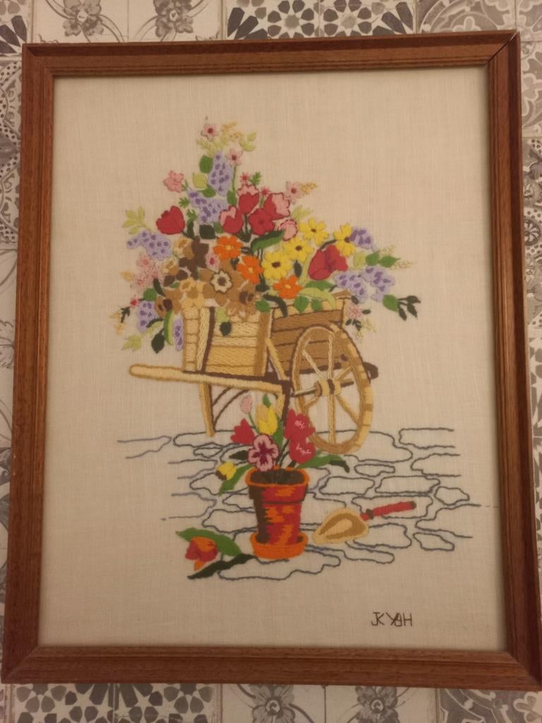 Borduurwerk kruiwagen met bloemen, Ophalen