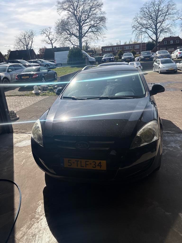 Kia (Pro) Cee d 1.4 Sporty Wagon 2009 Zwart, Auto's, Voorwielaandrijving, 4 cilinders, 1396 cc, Zwart