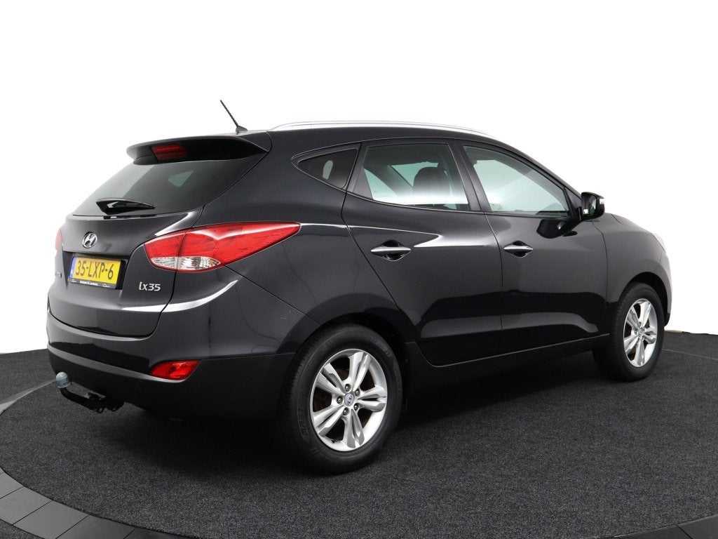 Hyundai ix35 2.0i Style (bj 2010), Auto's, Gebruikt, Zwart, 4 cilinders, Leder en Stof