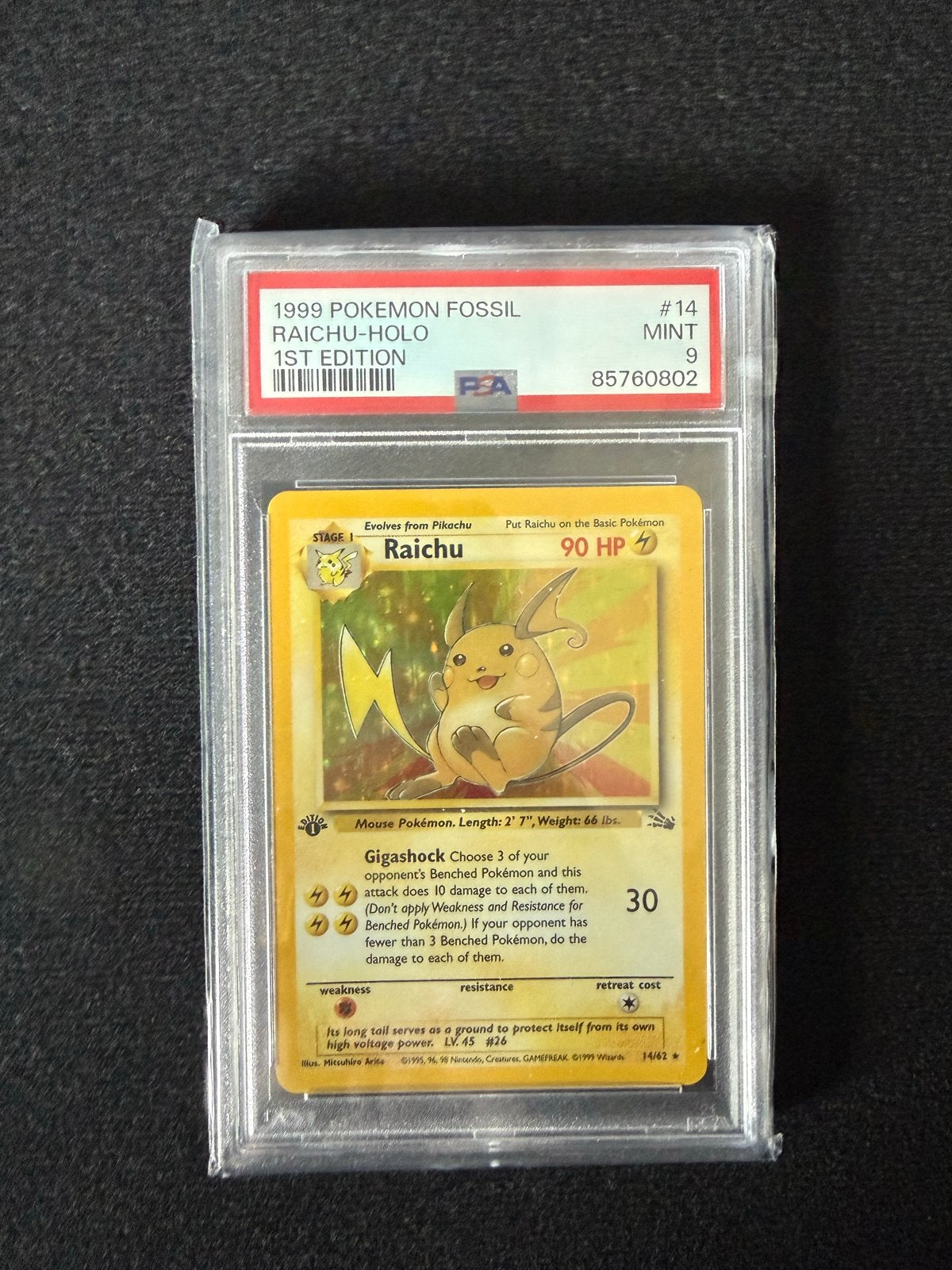Pokémon Raichu Holo 1st Edition PSA 9 Mint Fossil #14, Ophalen, Zo goed als nieuw, Losse kaart