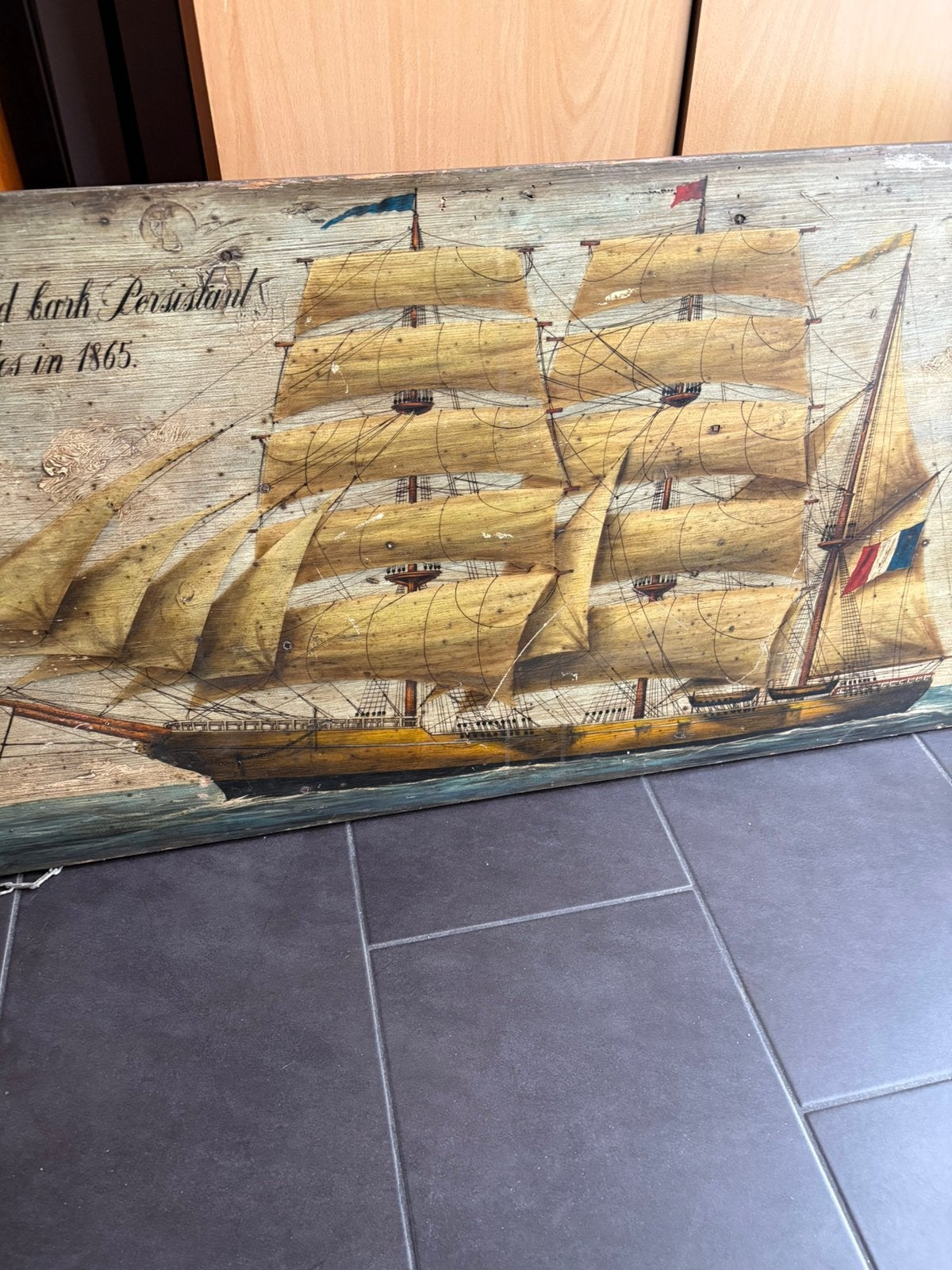 Antieke drie master op houten paneel, Ophalen