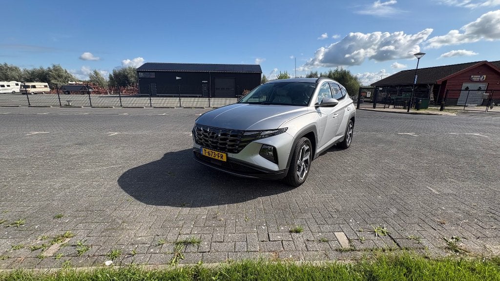 Hyundai Tucson 1.6 T-gdi HEV 230pk Aut. 2023 Grijs, Auto's, Dealer onderhouden, 4 cilinders, 1650 kg, Origineel Nederlands