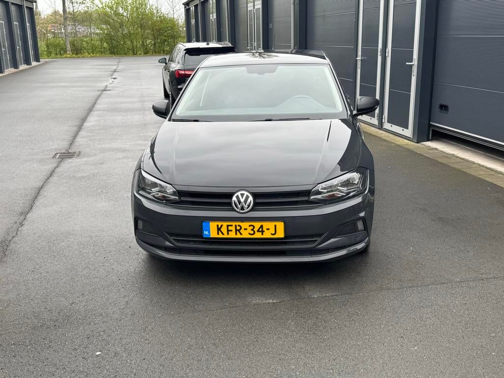 Volkswagen Polo 1.0 MPI Trendline, Auto's, Euro 5, Stof, Zwart, Inductieladen voor smartphones
