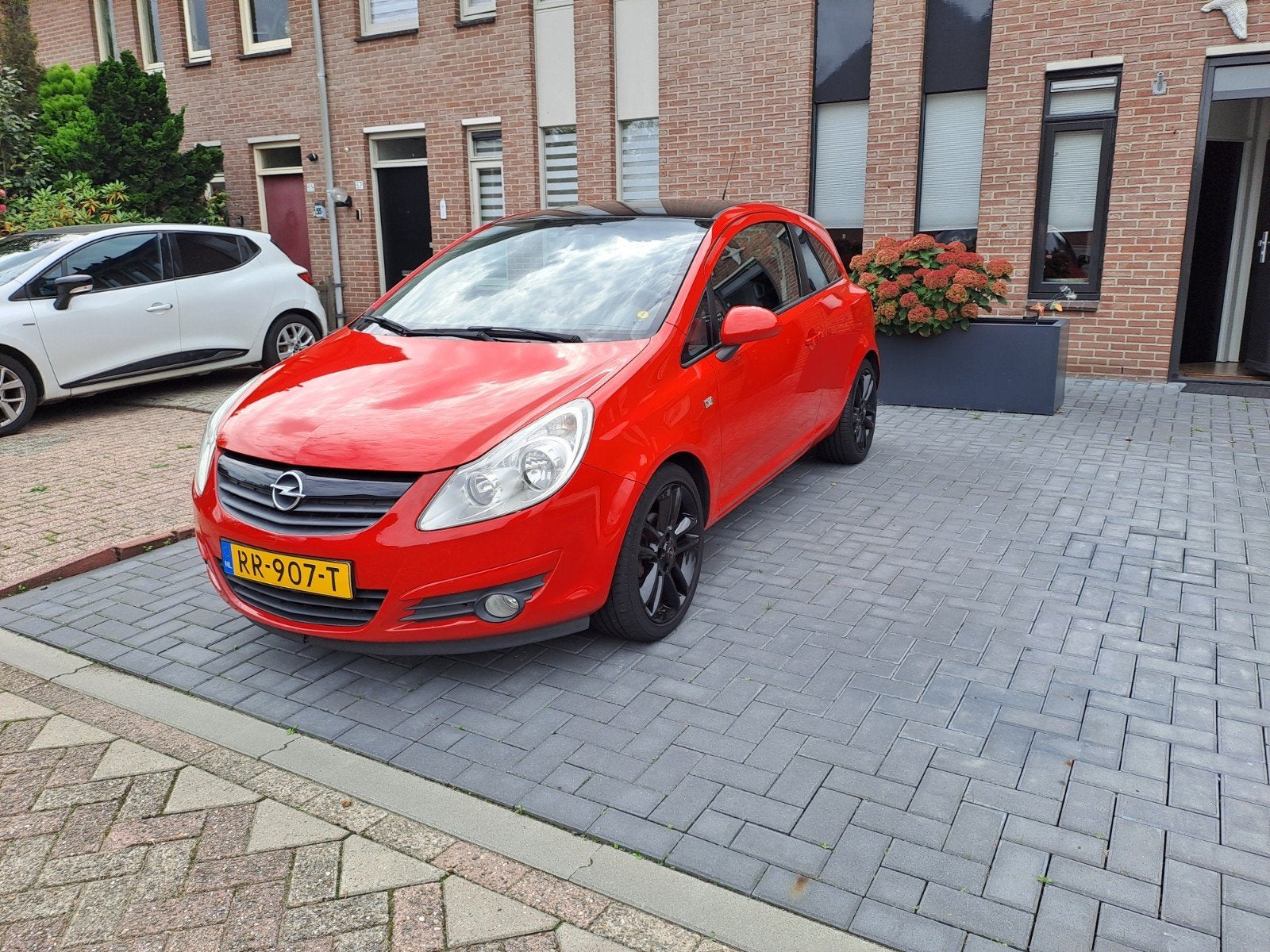 Opel Corsa 1.2 16V 3D 2009 Rood