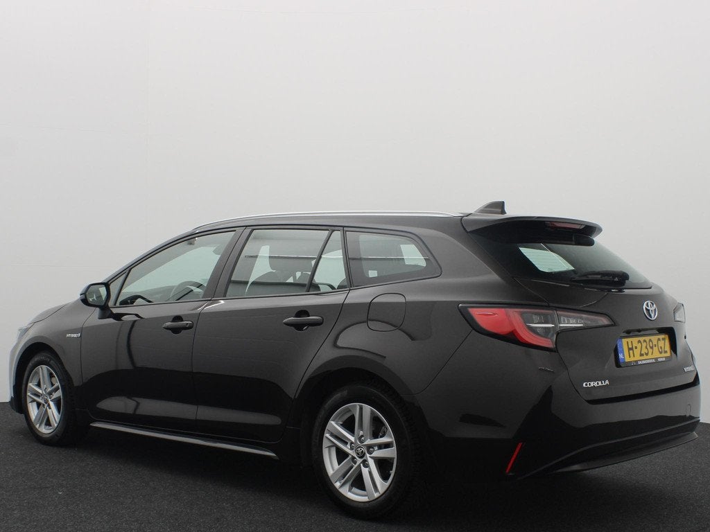 Toyota Corolla Touring Sports 1.8 Hybrid Business CAMERA / F, Auto's, Gebruikt, 4 cilinders, Bruin, Corolla