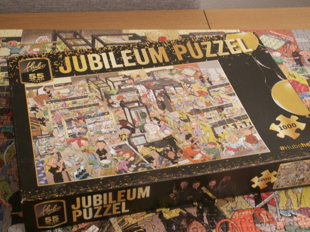 Hubo 55 jaar jubileum puzzel 1000 stukjes, Ophalen of Verzenden, 500 t/m 1500 stukjes, Zo goed als nieuw