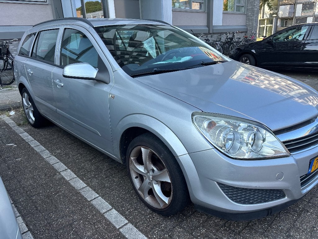 Opel Astra 1.4 16V St.wgn. 2008 Grijs, Auto's, Voorwielaandrijving, 639 kg, Origineel Nederlands, Stationwagon