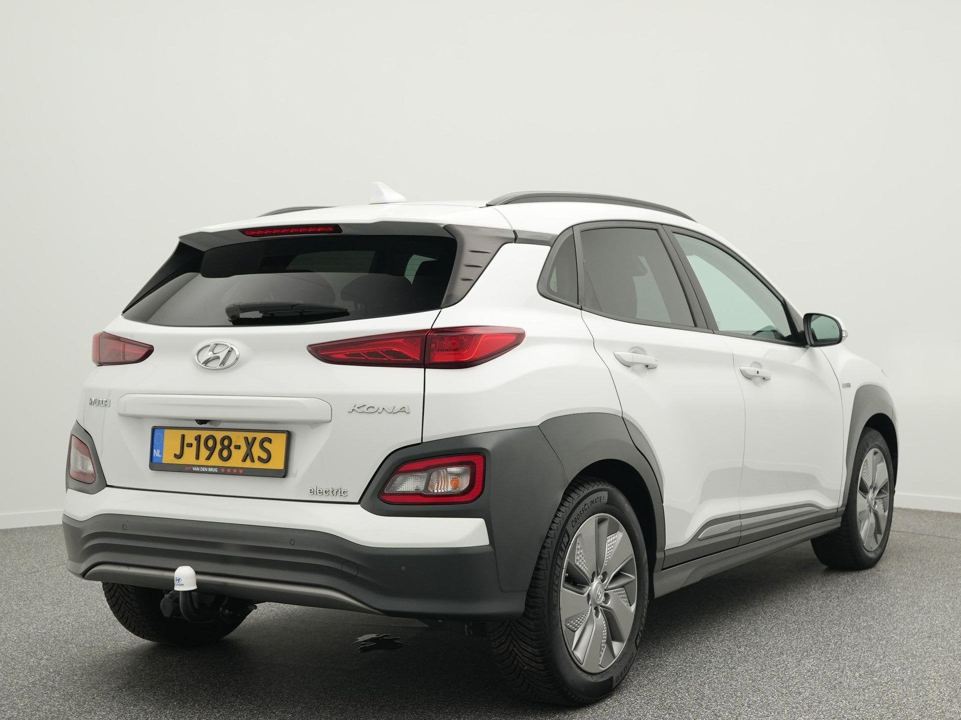 Hyundai Kona EV Fashion 64 kWh 204PK | SoH 96% | Trekhaak |, Auto's, Stof, Gebruikt, Wit, Origineel Nederlands