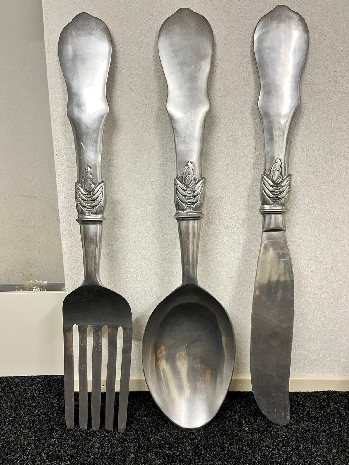 Grote decoratieve bestekset: vork, lepel en mes, Ophalen