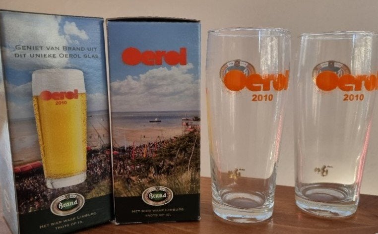 Hét unieke Brand Oerol glas 2010 - NIEUW in doos!, Ophalen of Verzenden, Zo goed als nieuw, Bierglas