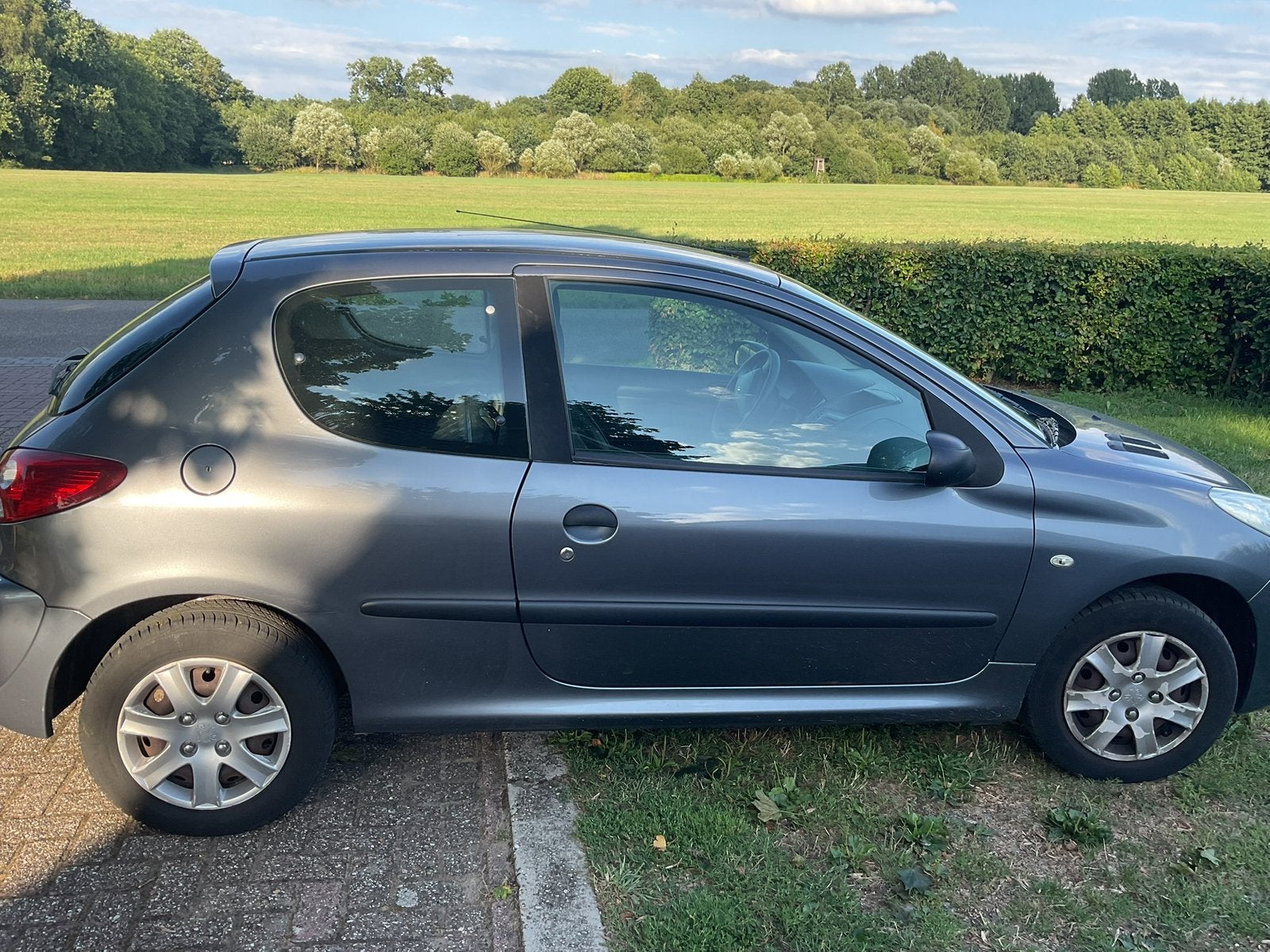 Peugeot 206+ 1.1 3D 2010 Grijs, Auto's, Peugeot, Voorwielaandrijving, 206+, 31 €/maand, 4 cilinders