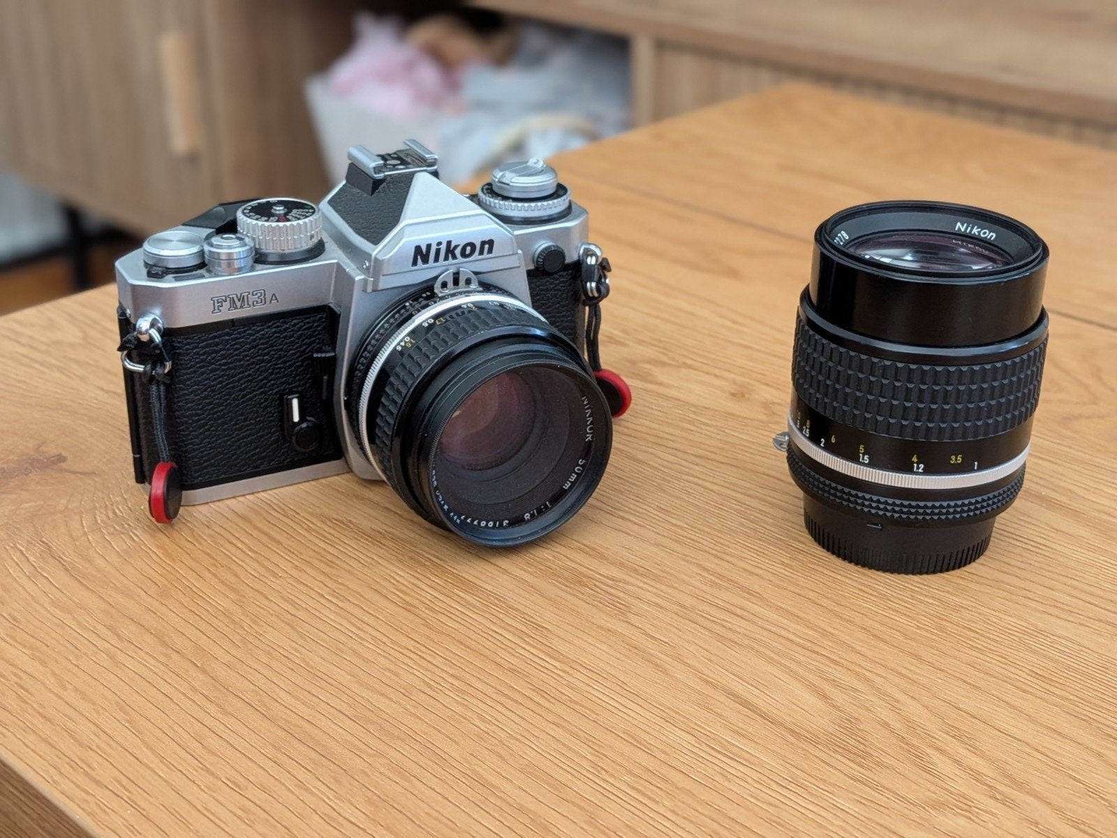 Nikon FM3A Chrome + Nikkor 50mm f/1.8 AIS + 105mm f/2.5 AIS, Ophalen of Verzenden, Spiegelreflex, Nikon