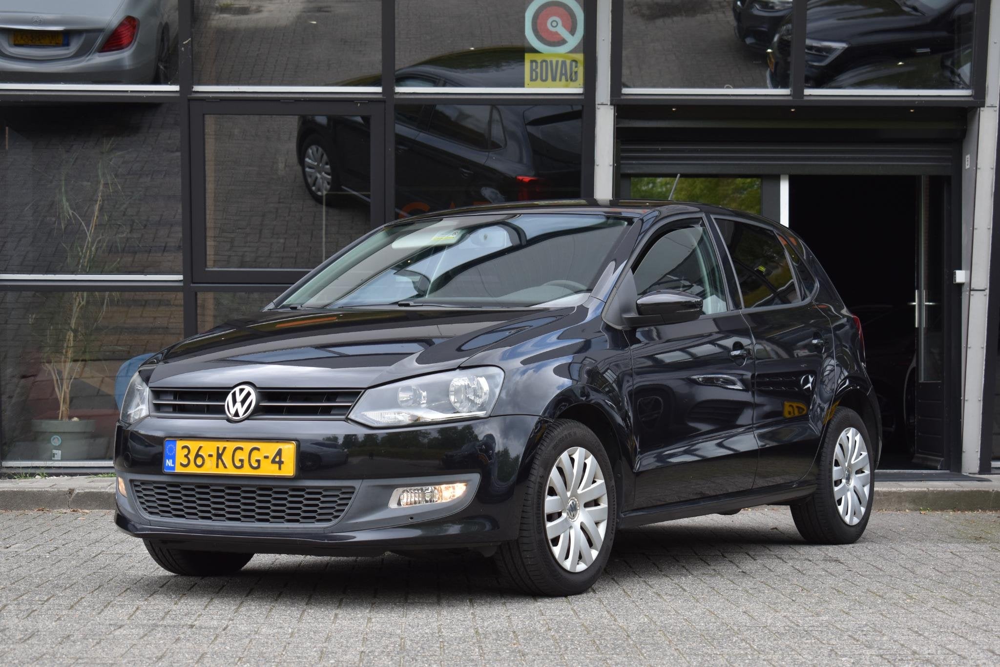 Volkswagen Polo 1.4-16V Comfortline Cruise Navi Airco Blueto, Auto's, Voorwielaandrijving, 4 cilinders, Met garantie (alle), Zwart