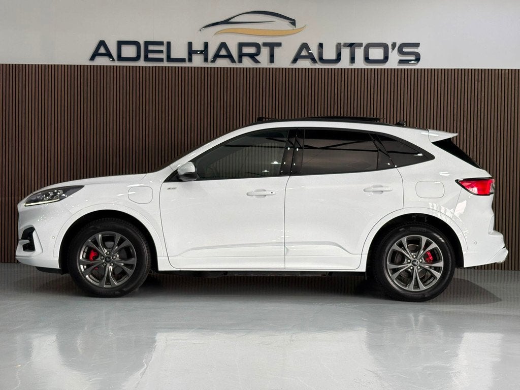 Ford Kuga 2.5 PHEV ST-Line X Automaat / Panorama dak / Adapt, Auto's, Ford, Gebruikt, Zwart, 4 cilinders, Wit