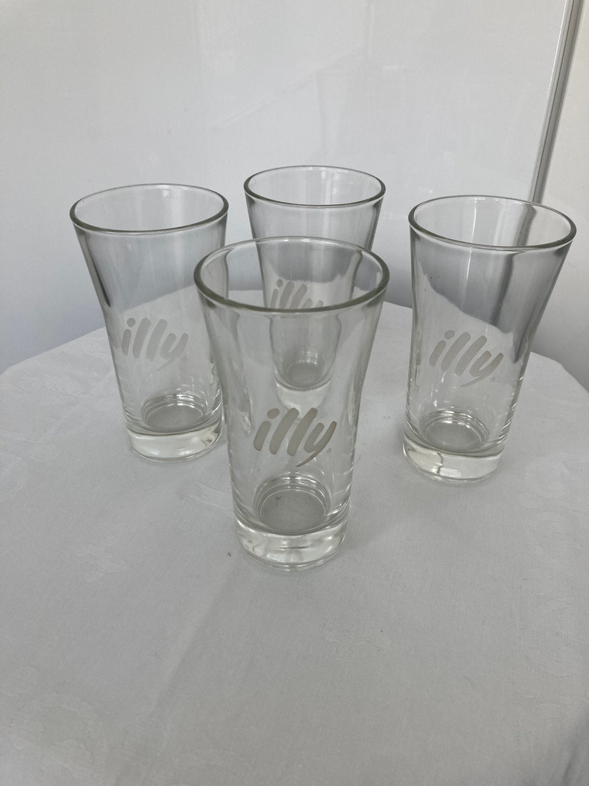 ILLY water-/Caffé Latte glazen. 4 Stuks, Ophalen of Verzenden, Zo goed als nieuw, Overige typen