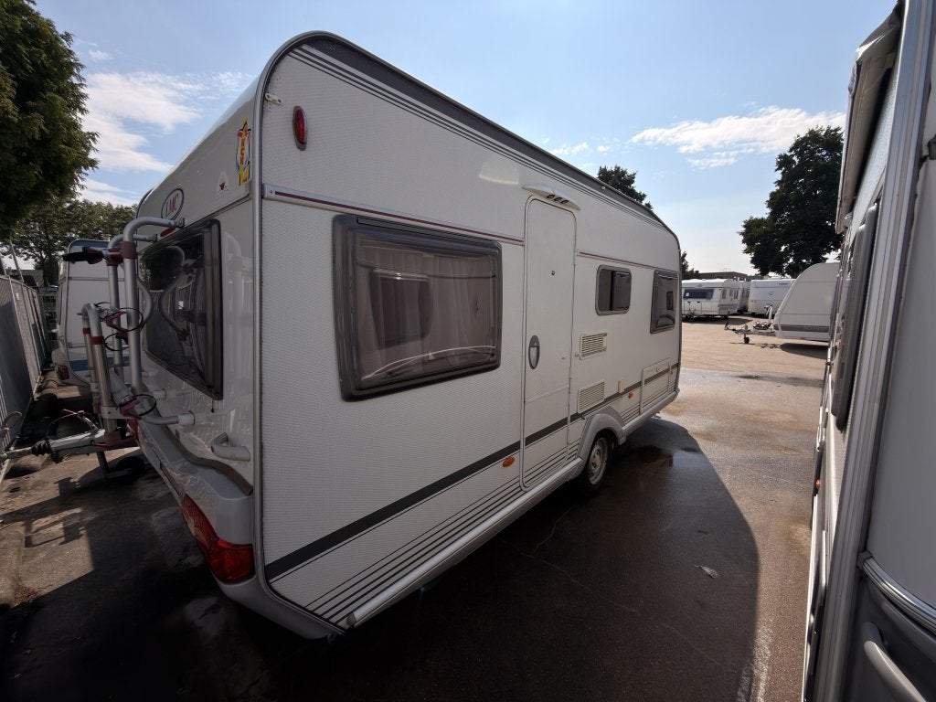 LMC Munsterland 490 P +mover, fietsrek, voorten, Caravans en Kamperen, Schokbreker, Rondzit, Bedrijf, 4 tot 5 meter