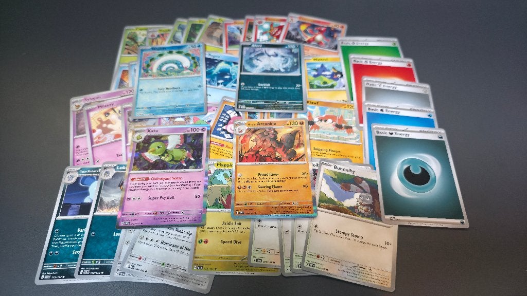 Bundel van 40 Pokémonkaarten, Ophalen of Verzenden, Zo goed als nieuw, Meerdere kaarten, Foil