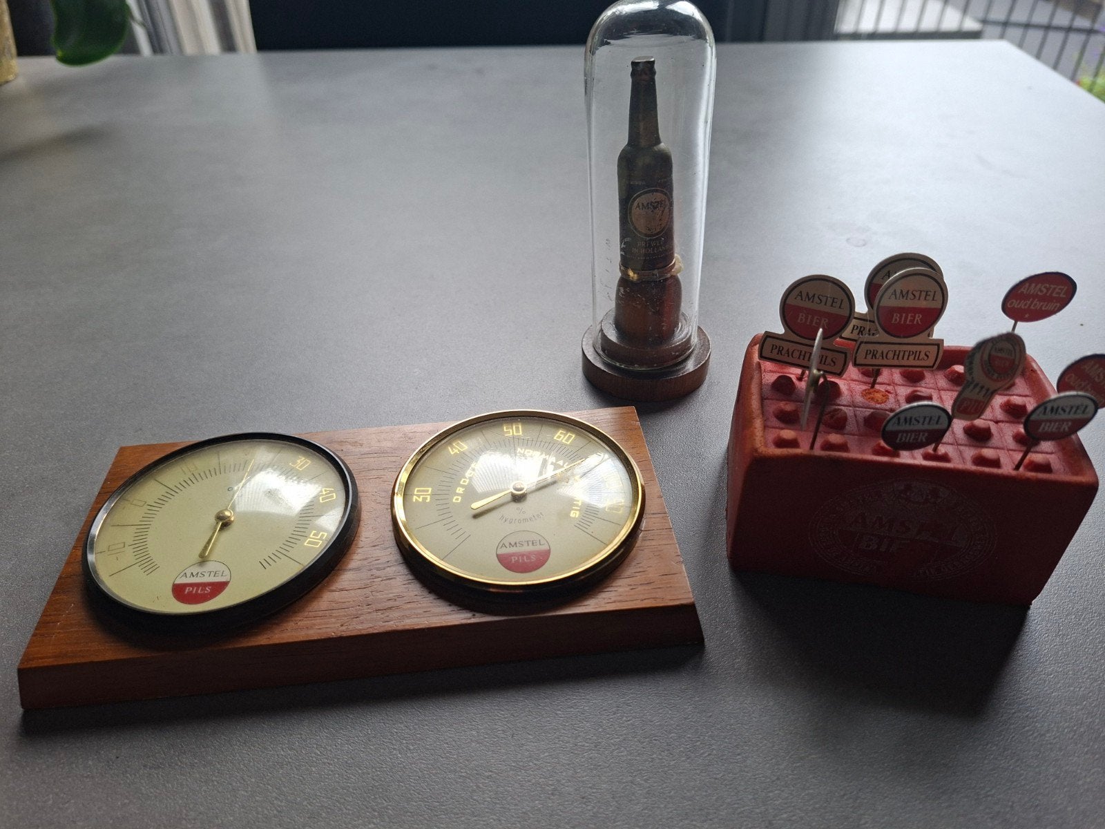 amstel bier spullen speldjes enz, Ophalen of Verzenden, Zo goed als nieuw, Reclamebord