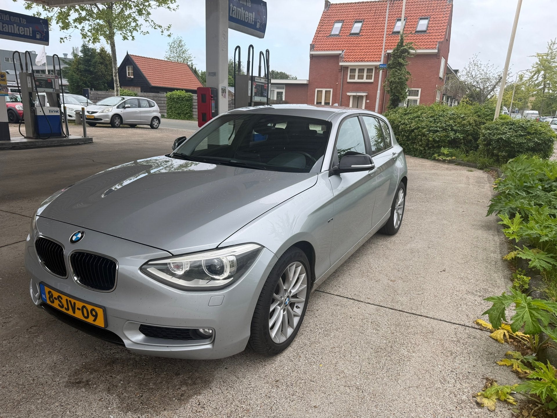 BMW 1-serie 116i Business AUTOMAAT-NAVI-CRUISE-PDC, Auto's, Euro 5, Gebruikt, Zwart, 4 cilinders