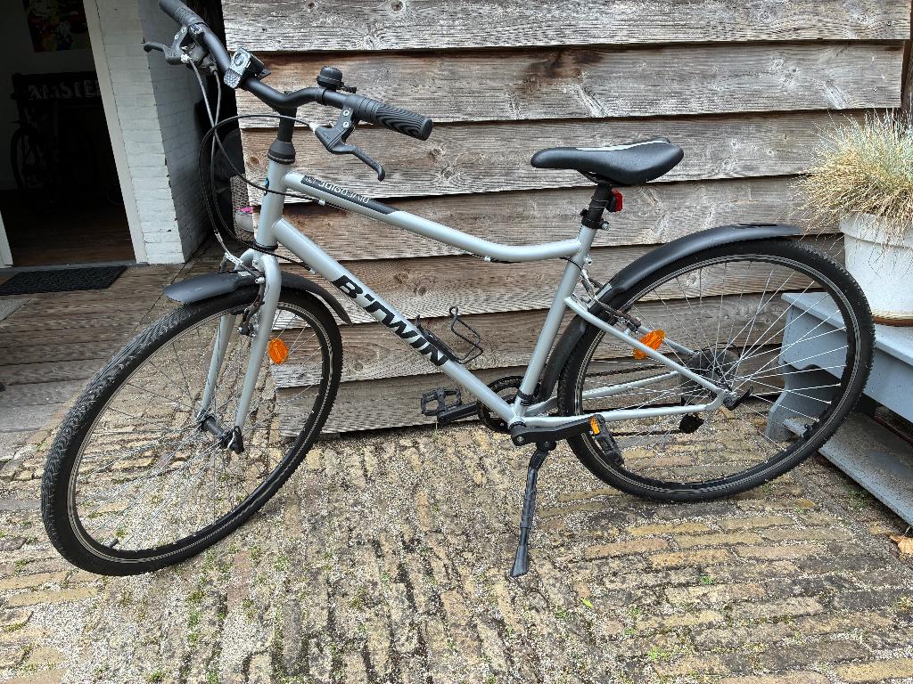 Te Koop B-Twin Riverside 120 Hybride fiets, 57 cm of meer, Velgrem, Zo goed als nieuw, Dames