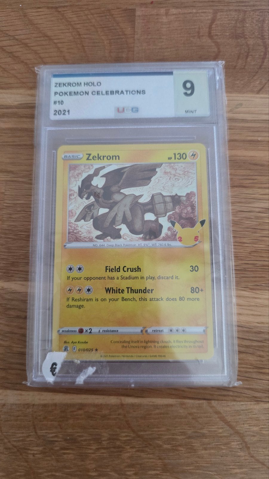 Pokémon Celebrations Zekrom Holo Graded 9 Mint, Ophalen of Verzenden, Zo goed als nieuw, Losse kaart, Foil
