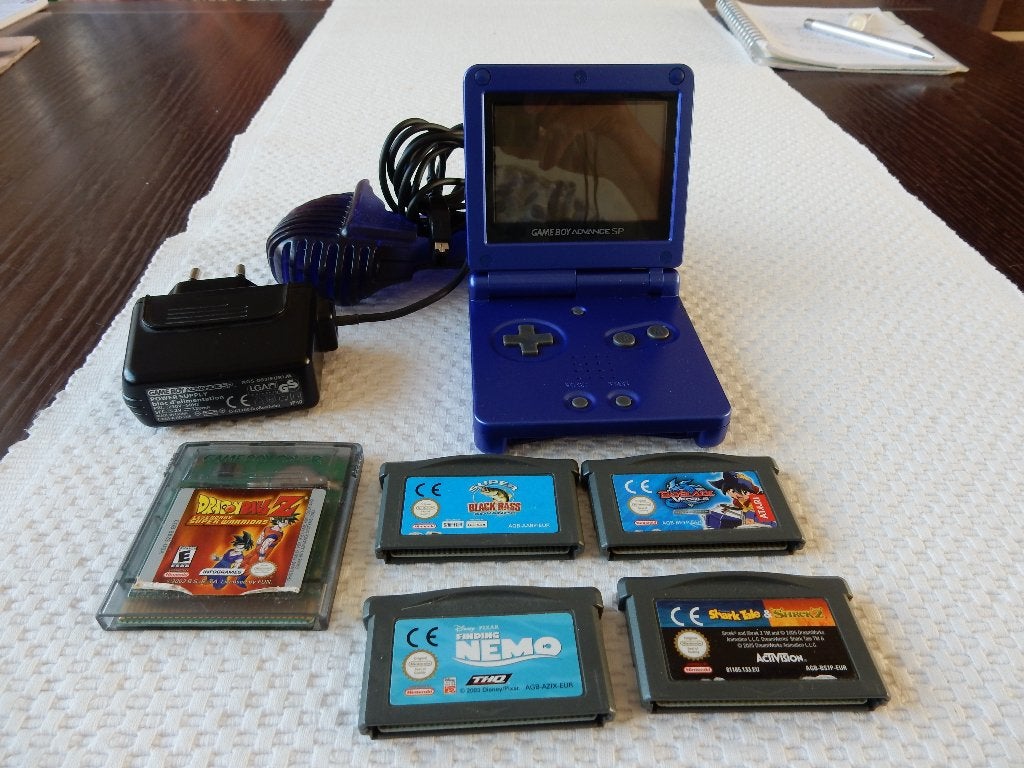 GAMEBOY ADVANCE SP kleur Blauw + Adapter en 5 spellen, Ophalen of Verzenden, Game Boy Advance SP
