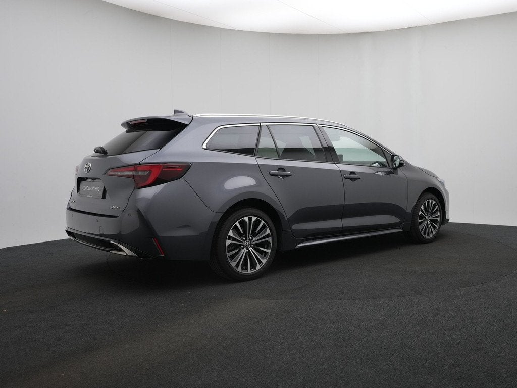 Toyota Corolla Touring Sports Hybrid 200 PK Dynamic || Nieuw, Auto's, Toyota, 12 maanden, Stof, Zwart, 4 cilinders