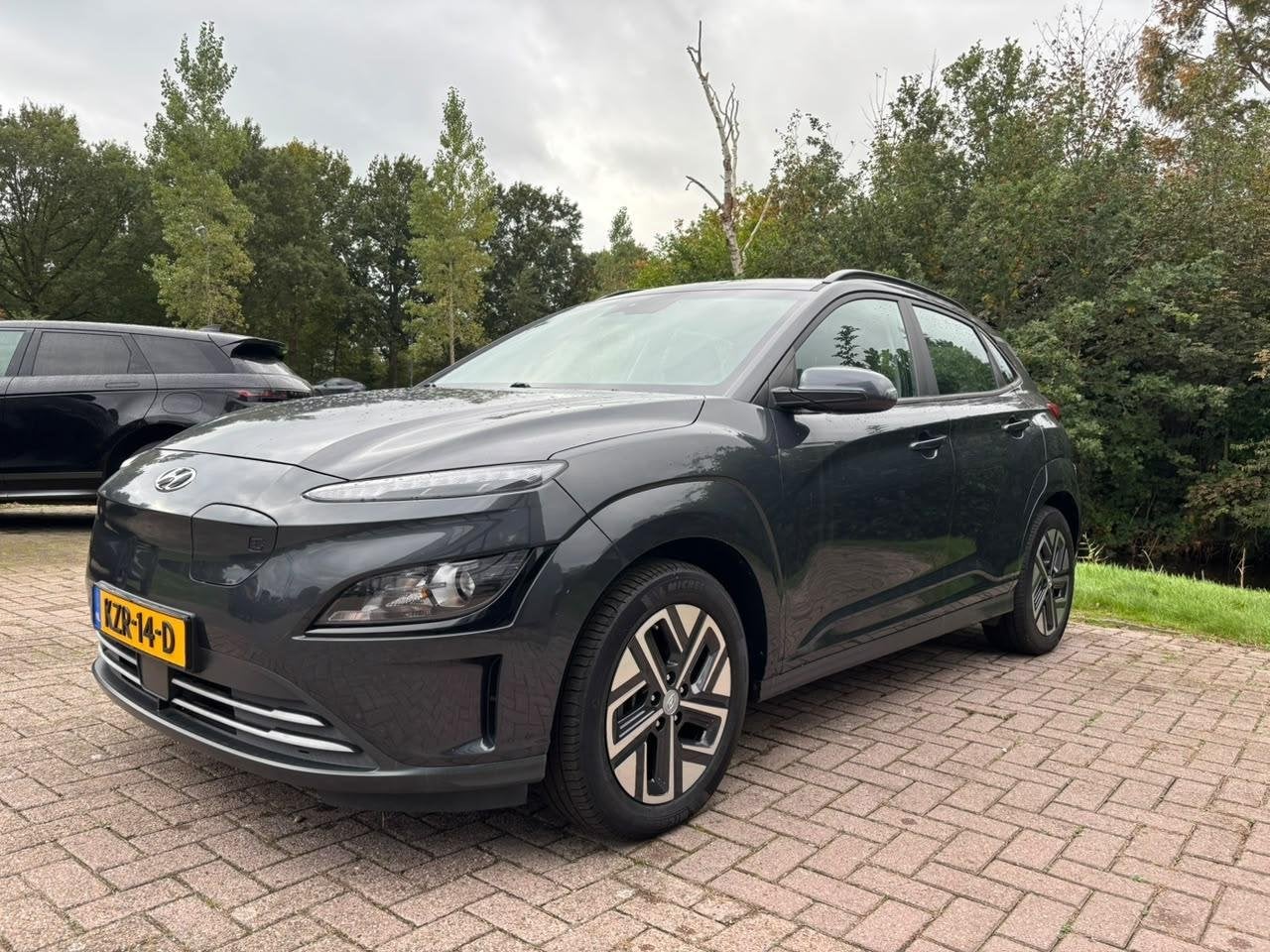 Hyundai Kona EV Fashion 64 kWh | 204 PK | SOH 95% | Adaptive, Stof, Gebruikt, 410 min, 64 kWh