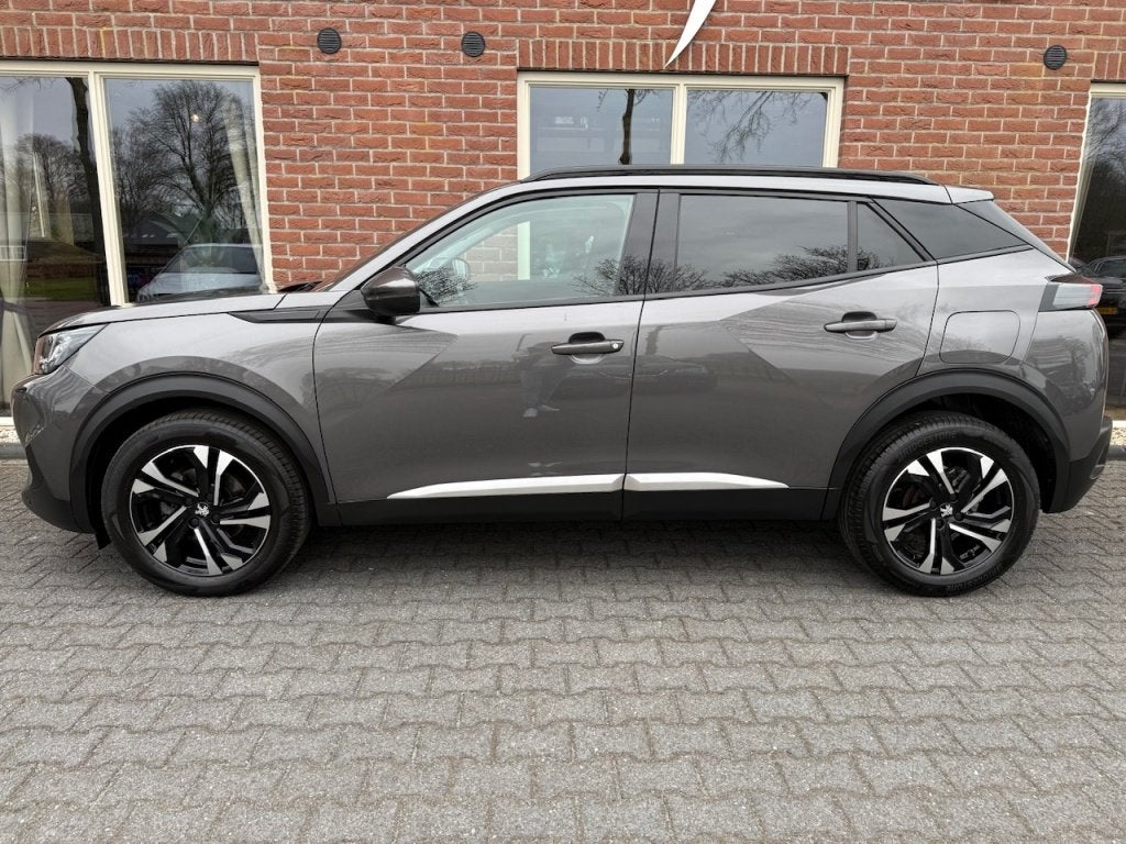 Peugeot 2008 1.2 PureTech Allure VIRTUAL.COCKPIT / HALF.LEER, Auto's, 1163 kg, Gebruikt, 1199 cc, Leder en Stof