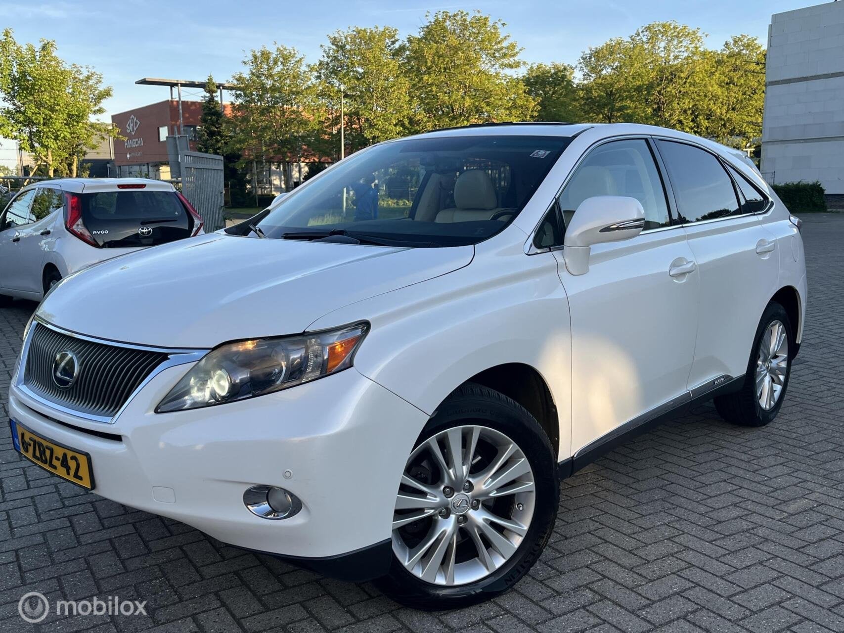 Lexus RX 450h 4WD President LEDER, Pano,Navi, Camera! Fijne, Auto's, Automaat, Gebruikt, Beige, 138 €/maand