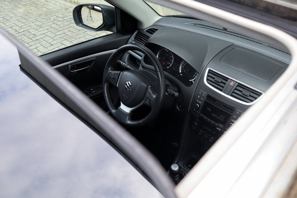 Suzuki Swift 1.2 Exclusive Open dakje!, Auto's, Suzuki, Voorwielaandrijving, Gebruikt, 4 cilinders, 400 kg