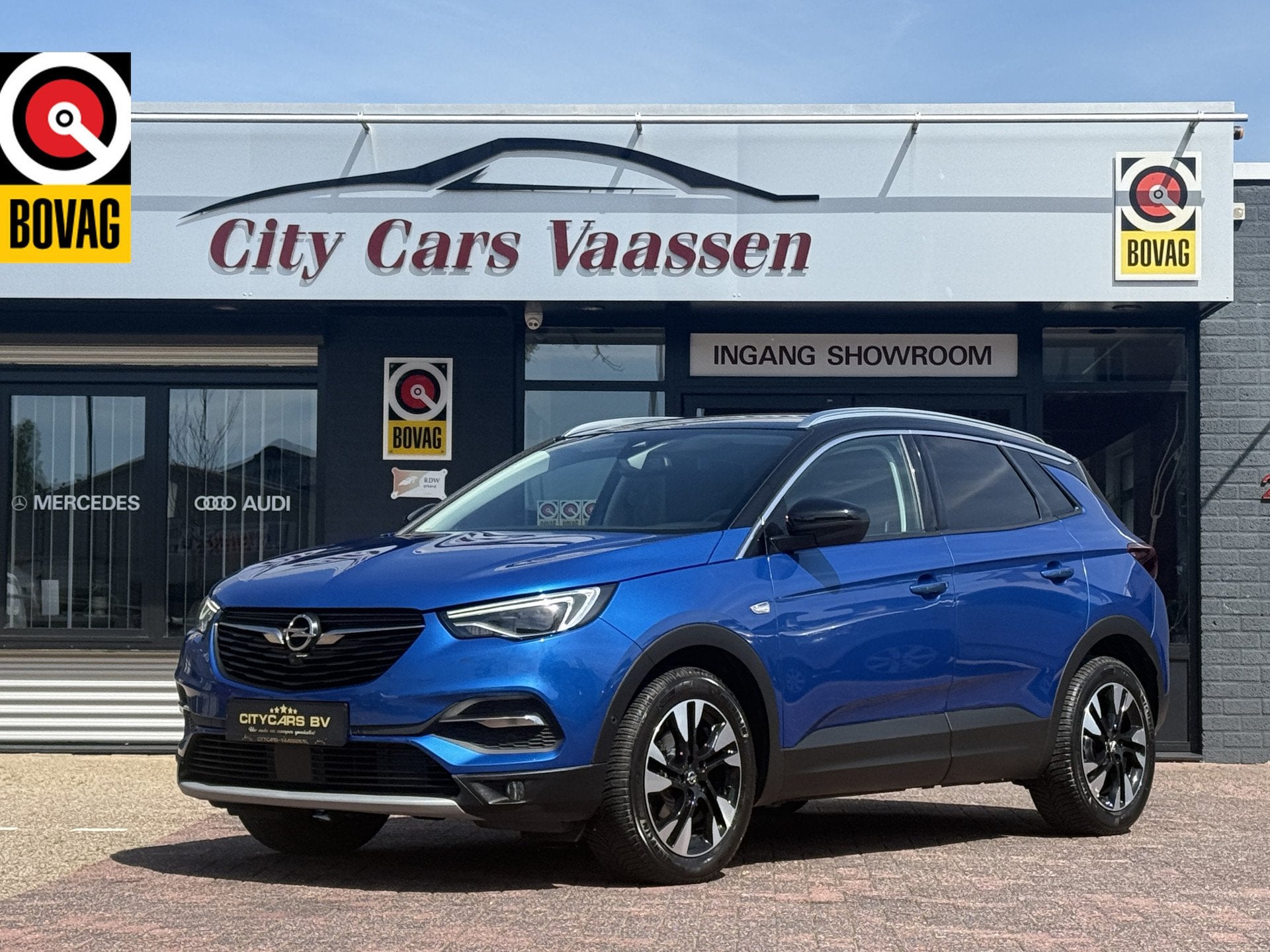 Opel Grandland X 1.2 Turbo Ultimate 131 pk automaat org nl a, Auto's, Gebruikt, 1199 cc, Blauw, Leder en Stof
