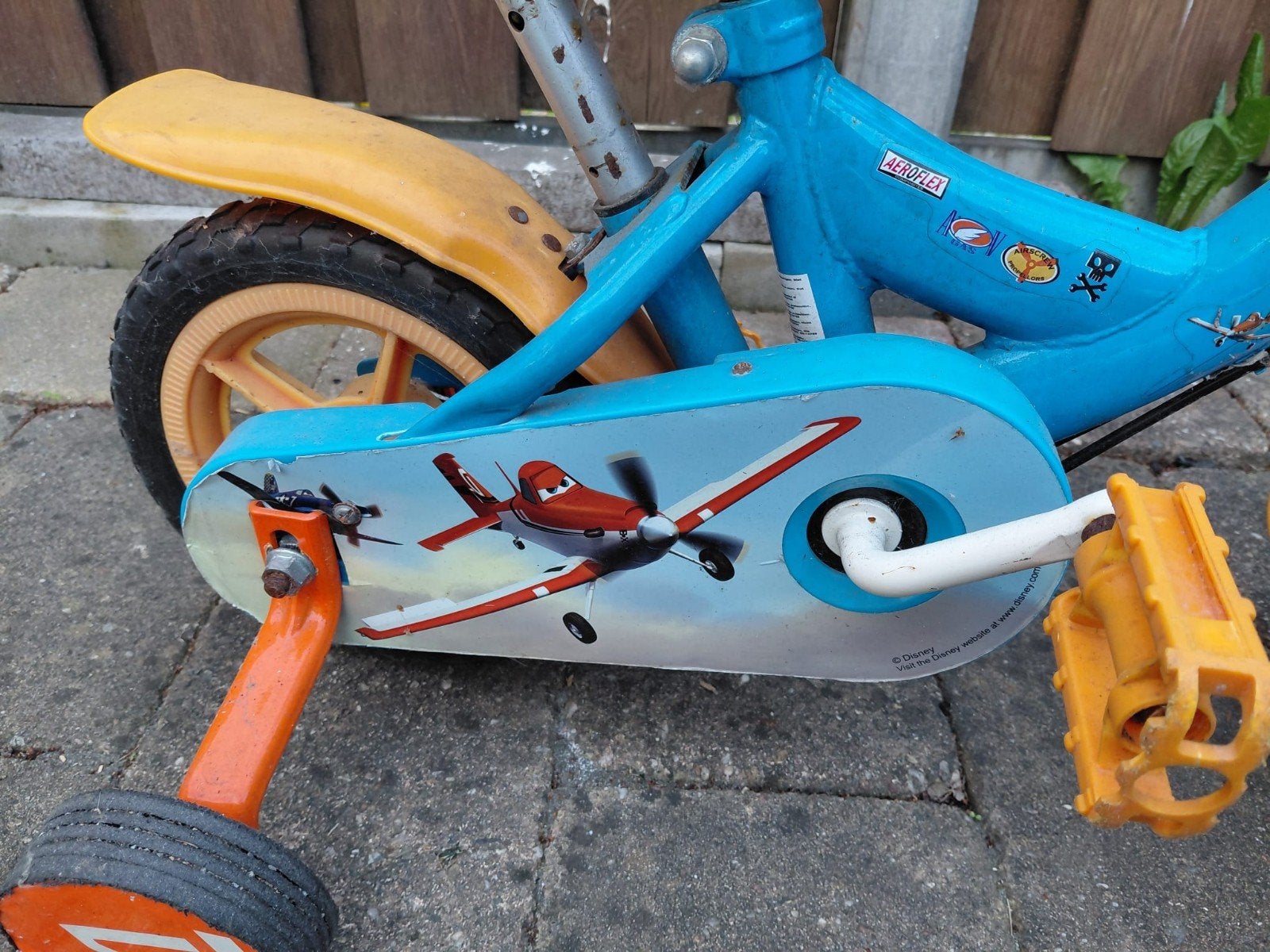 Kinderfiets Disney Planes Dusty met zijwieltjes, Ophalen, Zijwieltjes, Gebruikt, Velgrem