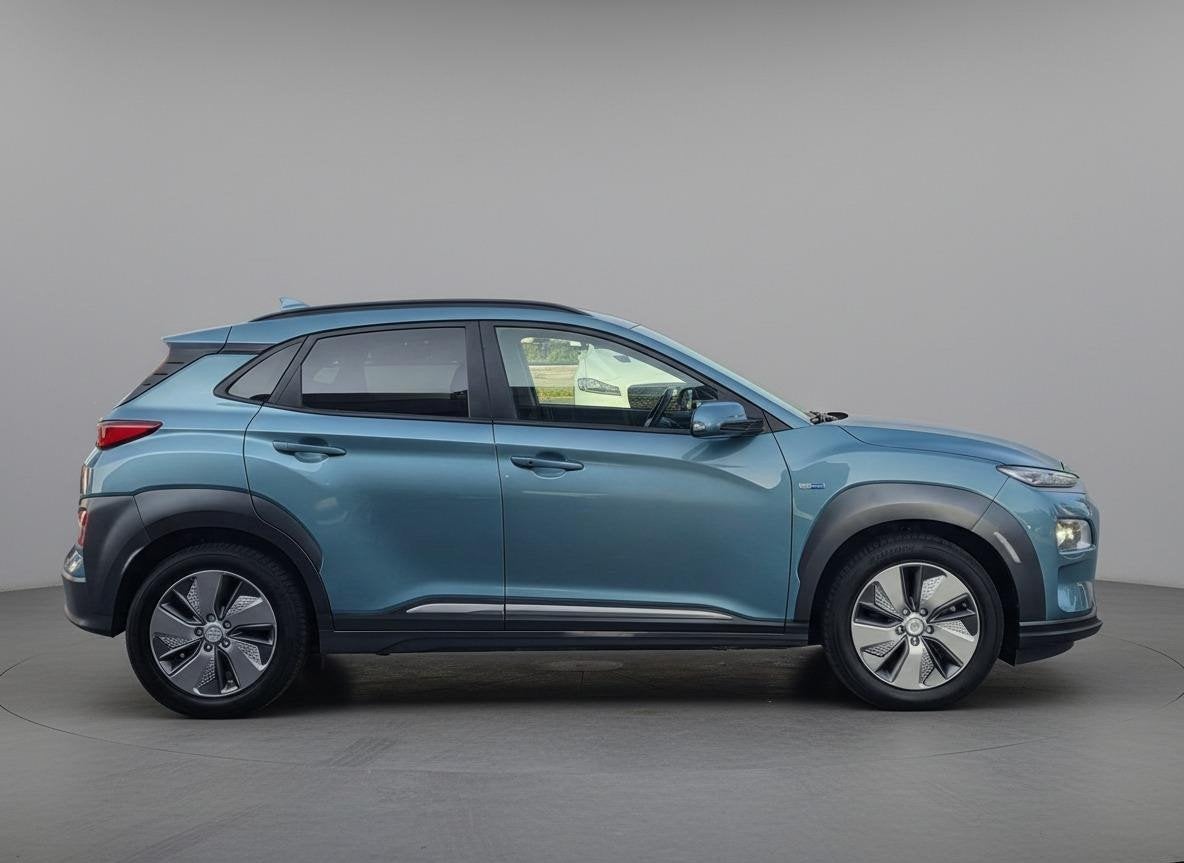 Hyundai Kona EV Premium 64kWh | SOH 89% | Leder | Stoelventi, Gebruikt, Adaptive Cruise Control, Blauw, 630 min