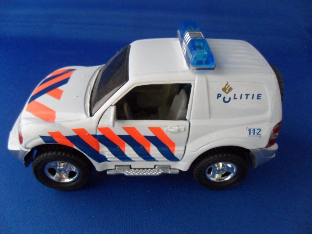 Politieauto Mitsubishi Pajero  1,43, Hobby en Vrije tijd, Ophalen of Verzenden, Zo goed als nieuw, Auto, Overige merken