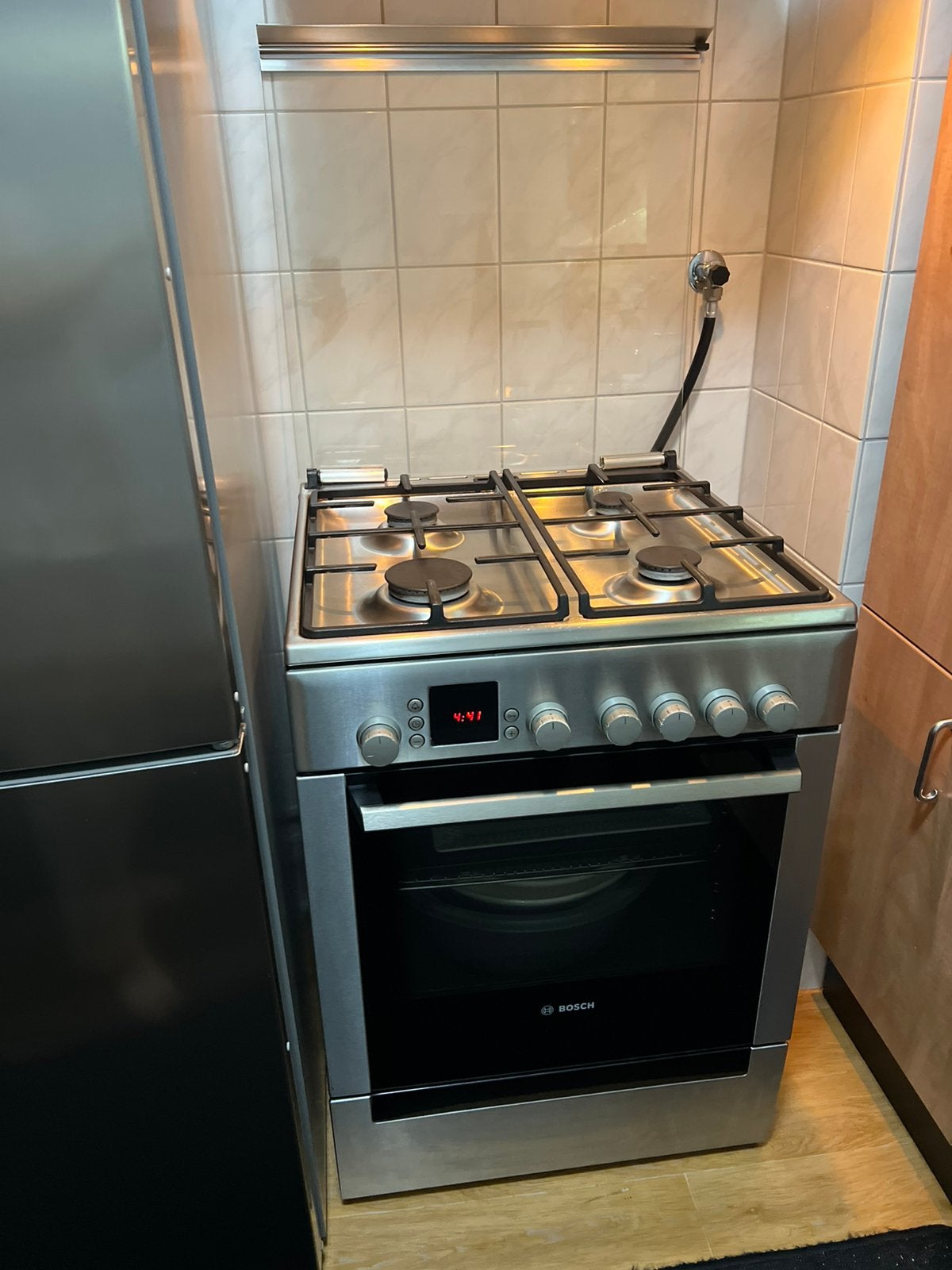 Bosch gasfornuis RVS 4-pits + RVS afzuigkap zeer nette staat, Ophalen, 4 kookzones, Zo goed als nieuw, Gas