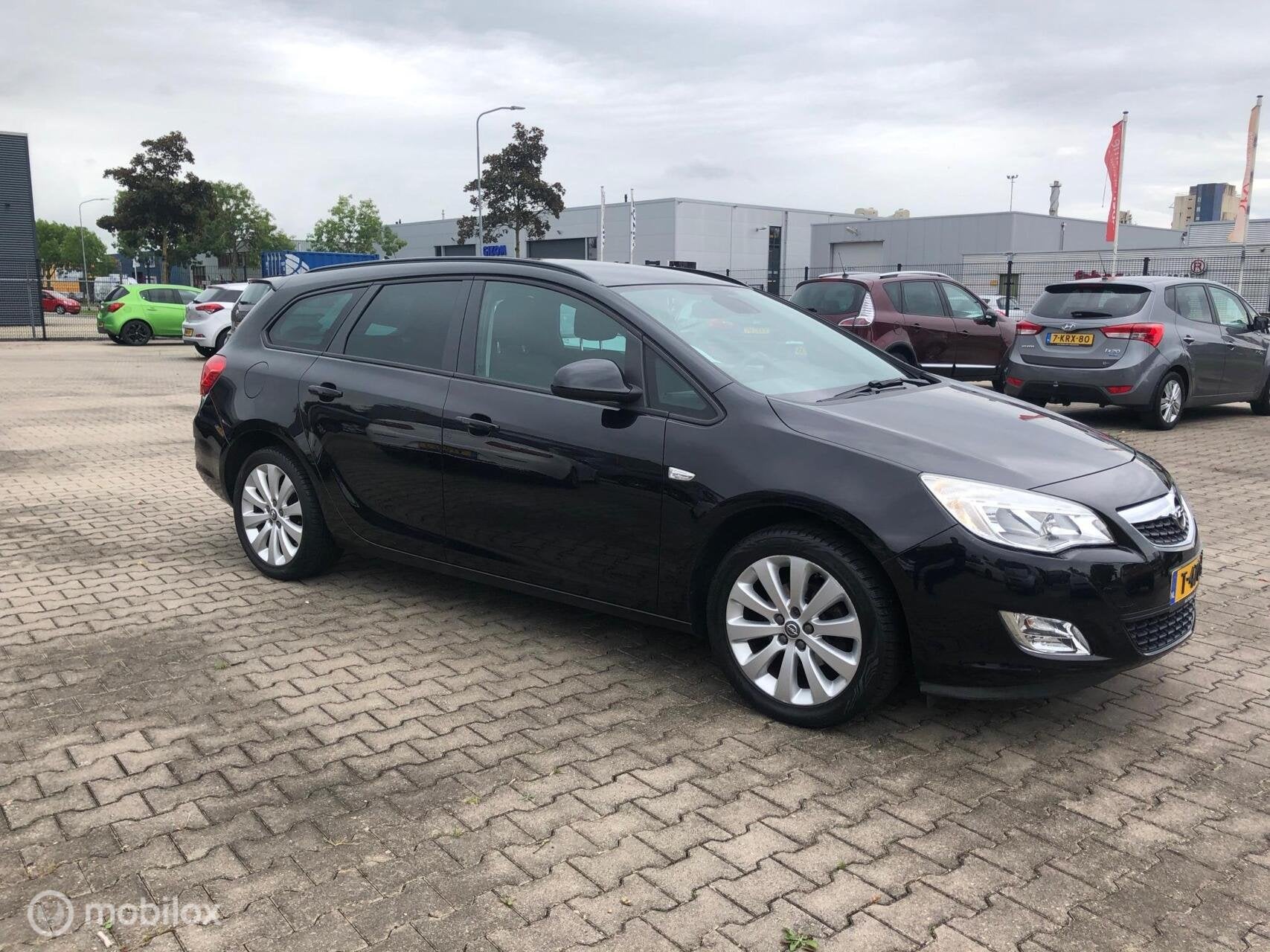 Opel Astra Sports Tourer 1.4 Turbo Cosmo Navi Cruise Airco, Auto's, Voorwielaandrijving, Euro 5, Stof, Gebruikt