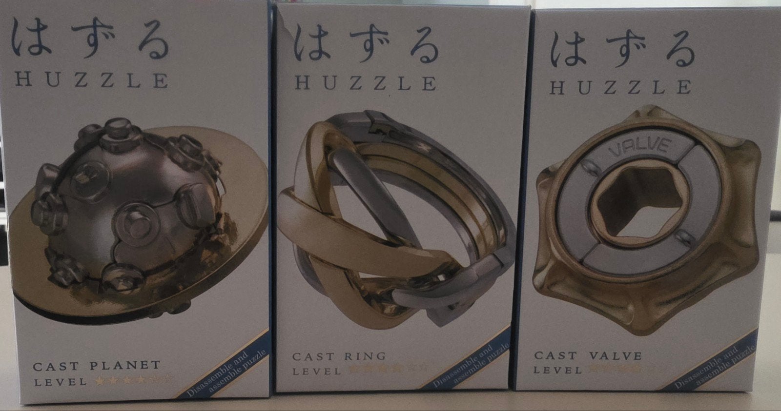 Hanayama huzzle puzzle,3x 4* casts ring, valve, planet, Hobby en Vrije tijd, Denksport en Puzzels, Ophalen of Verzenden, Zo goed als nieuw