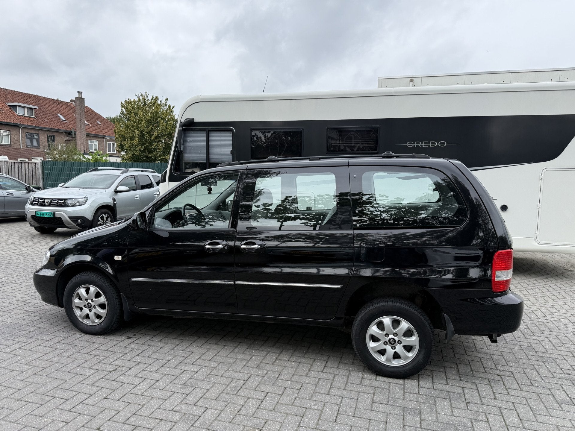 Kia Carnival 2.5 V6 EX Automaat - Rolstoelauto 4+1 - XXL Fre, Gebruikt, Zwart, Origineel Nederlands, Bedrijf