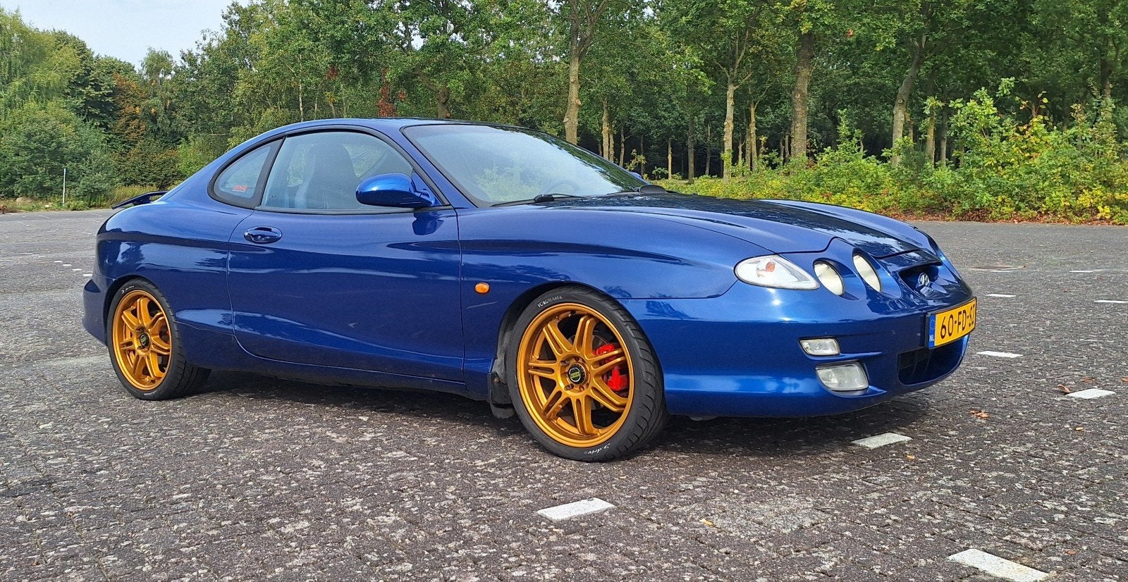 Hyundai Coupé 2.0i FX, Gereviseerde motor + Veel Extra's!, Auto's, Voorwielaandrijving, Zwart, Leder en Stof, Handgeschakeld