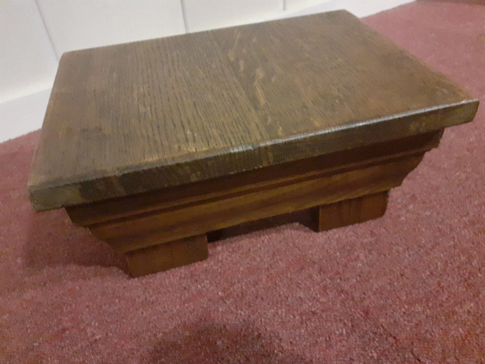 houten voetensteun, Ophalen