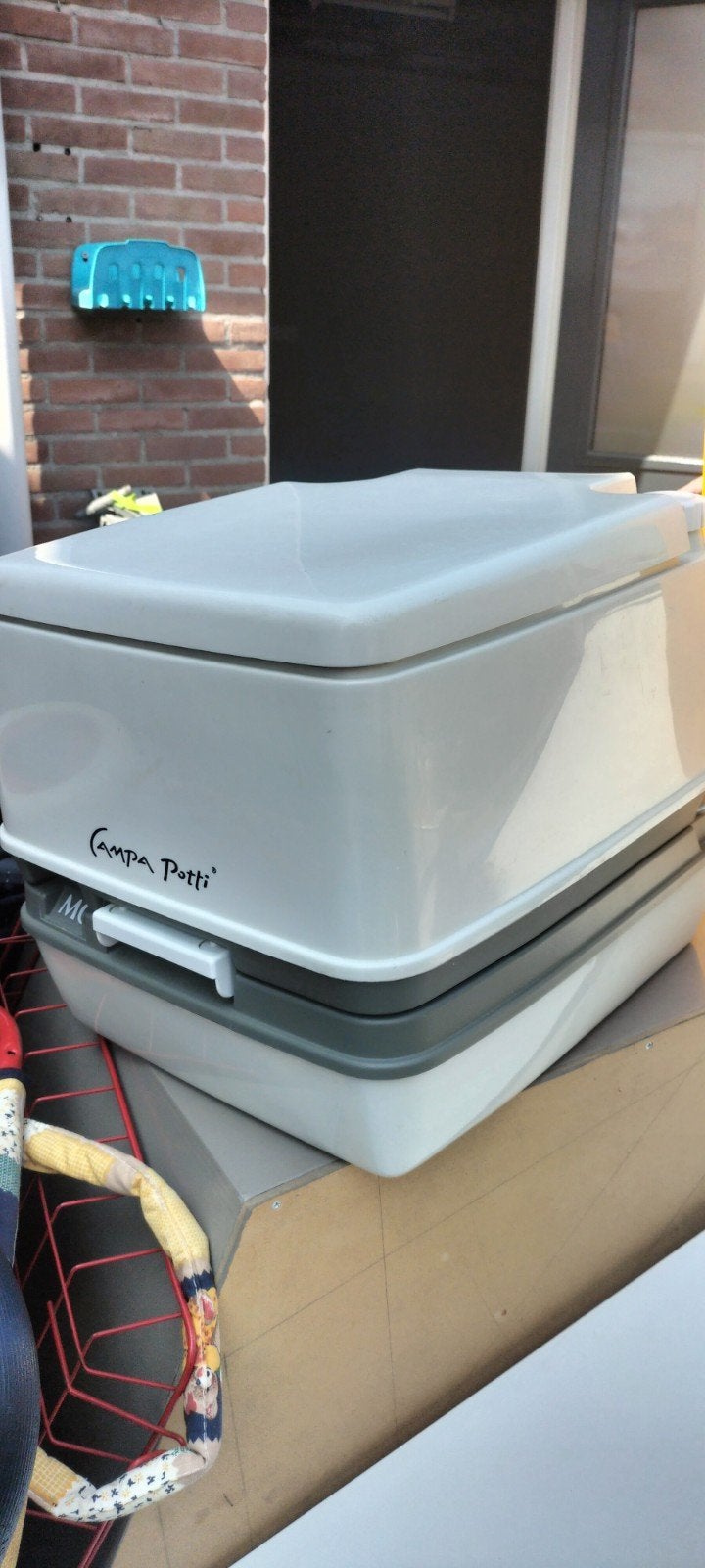 Campa Potti draagbaar toilet met vloeistoffen, Ophalen