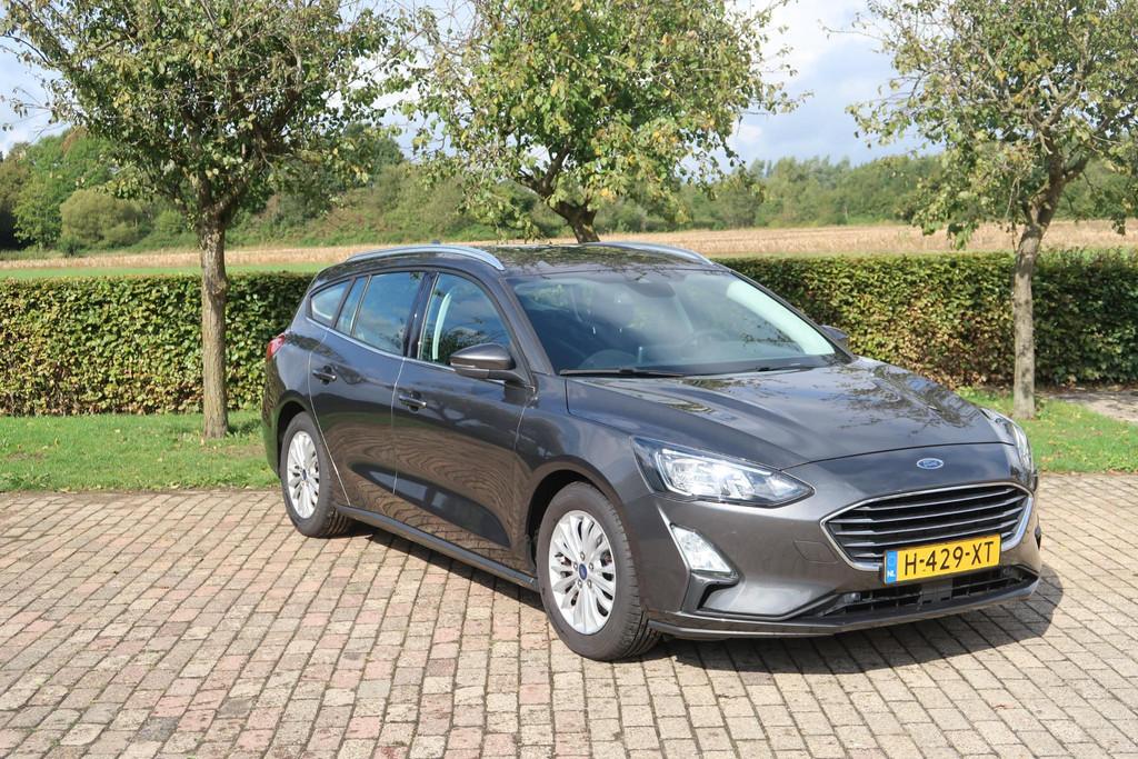 Ford Focus Wagon 1.0 EcoBoost Titanium Business, Gebruikt, Lichtsensor, Met garantie (alle), Origineel Nederlands