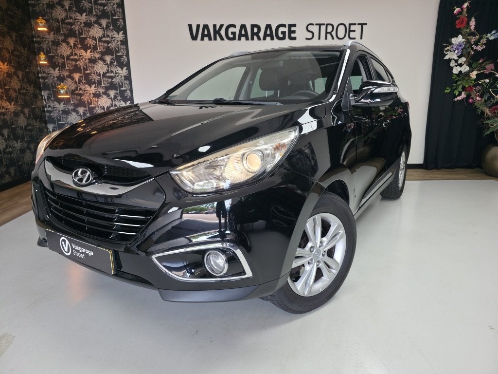 Hyundai ix35 2.0i Bus.Ed. | cruise | cam | clima | trekhaak, Auto's, Hyundai, Gebruikt, Zwart, 4 cilinders, Leder en Stof