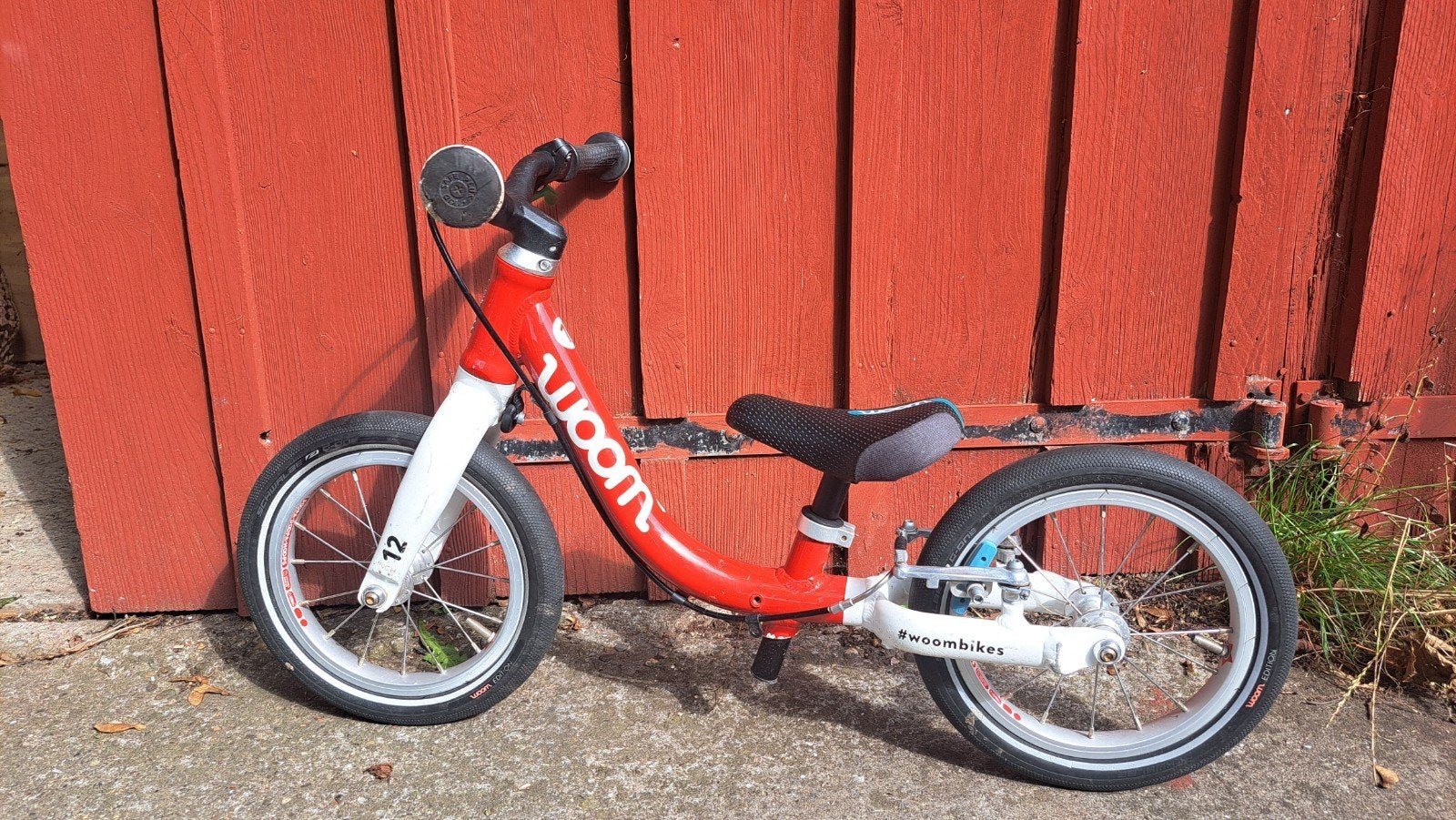 Woom 1 – Superlichte 12 inch loopfiets met handrem, Gebruikt, Velgrem, Ophalen of Verzenden, Minder dan 16 inch