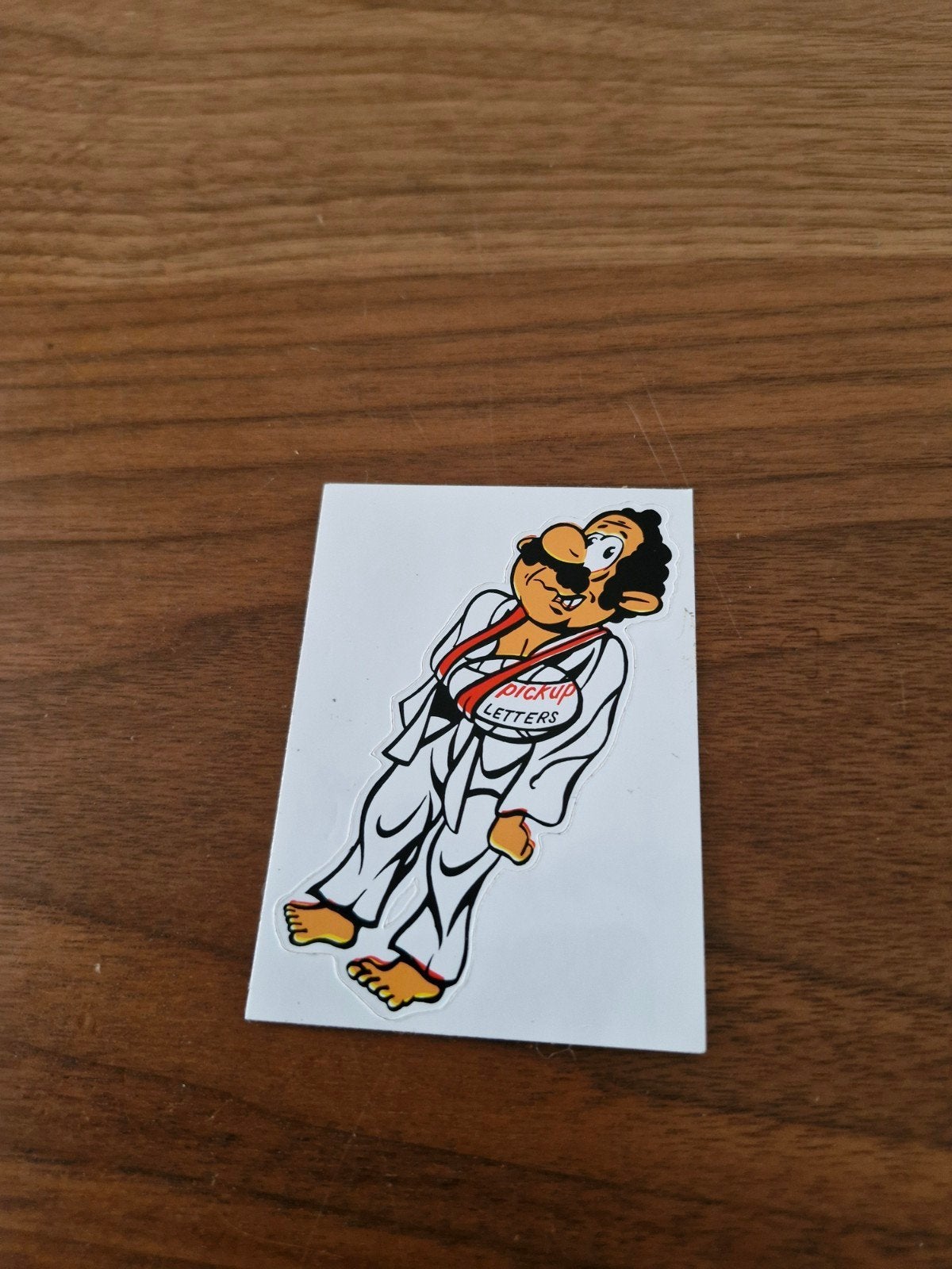 527 Sticker met stripfiguur in judopak - Nieuw, Ophalen of Verzenden, Nieuw, Strip of Tekenfilm