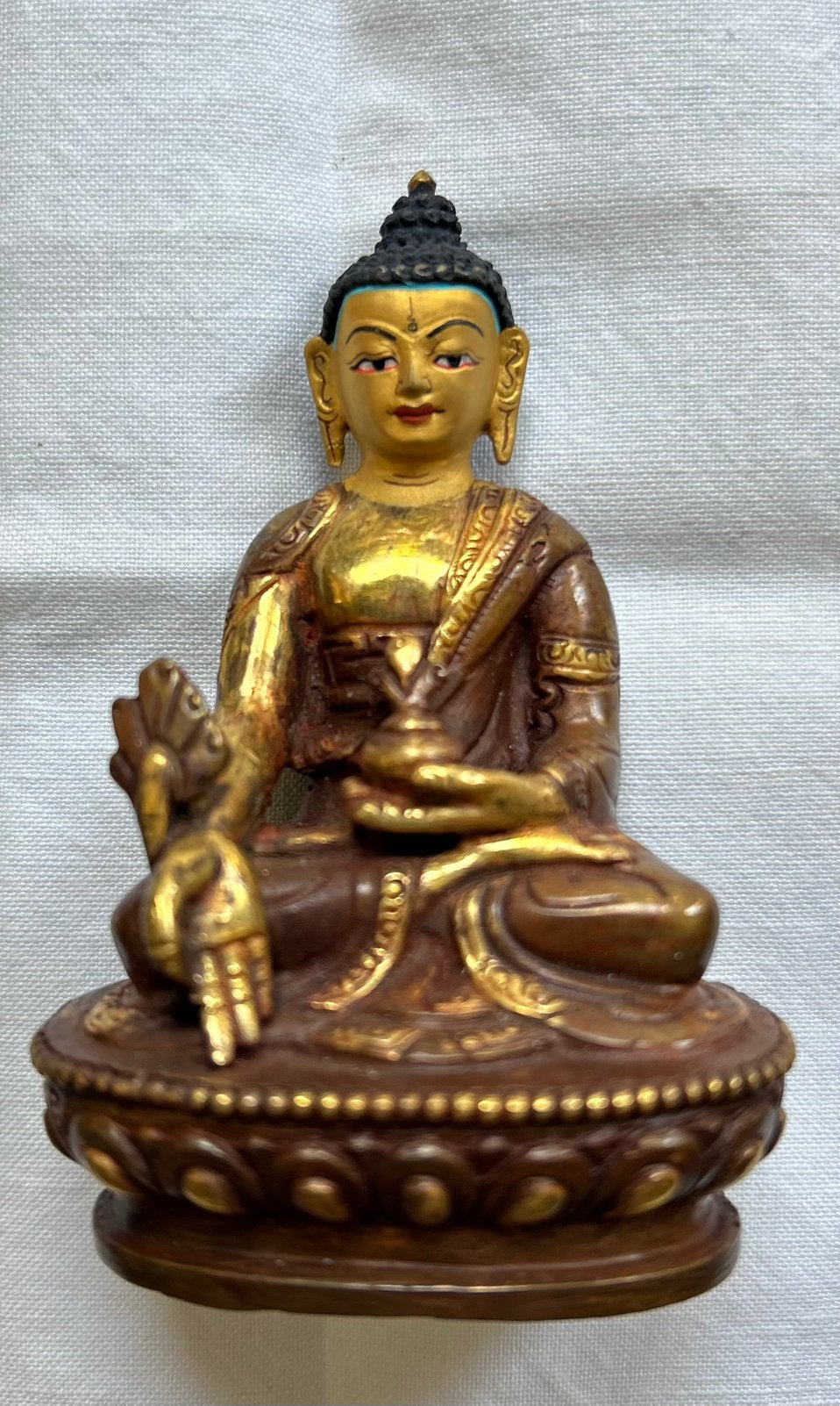 Bronzen boeddhabeeld Nepal “gold-face” 8,5 cm, Ophalen of Verzenden, Zo goed als nieuw, X, X